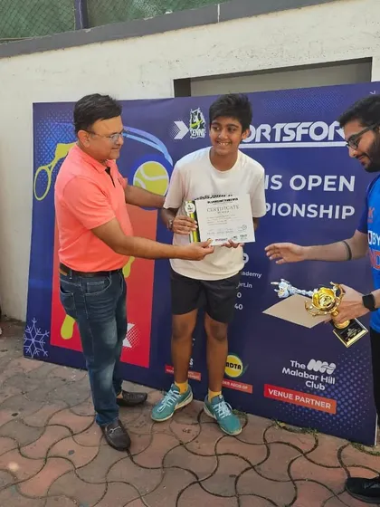 Rehaan Jain receiving his runner-up trophy at the Sportsfort Tennis Open.