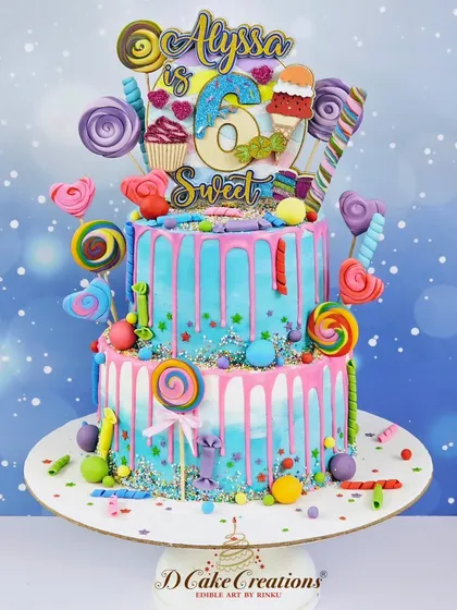 The full view of the two-tier "Sweet 6" candyland cake, a colorful explosion of fun for a very special birthday girl.