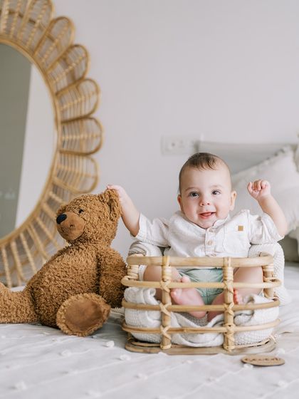 Another shot from the same seven-month session, this time with his teddy bear friend.