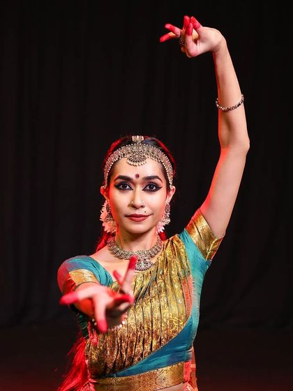 Another angle showing the consistency and symmetry of the makeup. The red bindi and defined lips complete this timeless classical dance look, ready for any stage.