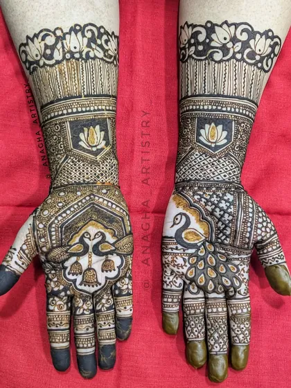 A semi-bridal design that is both intricate and elegant. It features beautiful peacock and lotus motifs, perfect for an engagement or other pre-wedding ceremony.