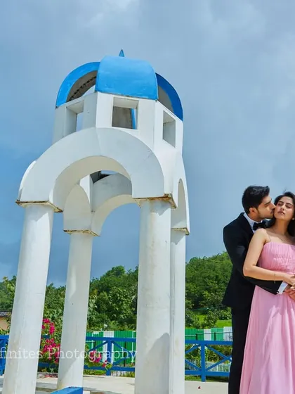An intimate moment captured under the iconic blue dome of our Santorini set, offering a perfect destination-style photo without the travel.
