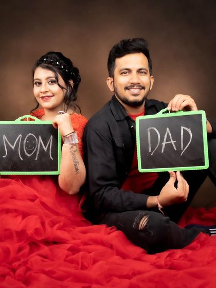 A fun and cute shot of the parents-to-be. Her makeup is simple and pretty, perfect for this playful photo.