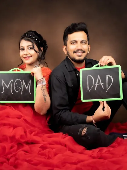 A fun and cute shot of the parents-to-be. Her makeup is simple and pretty, perfect for this playful photo.