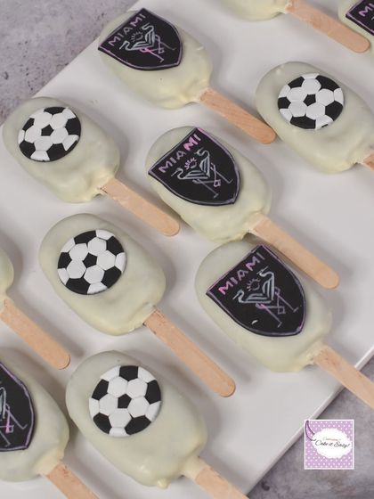 A closer look at the Inter Miami themed cakesicles. The logos are printed on edible paper for a sharp, clean look.