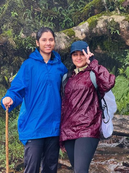 Two friends posing in their raincoats during a break on the Kudremukha trail. The monsoon adds a layer of fun and challenge.