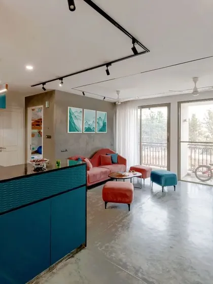 This view shows the open-plan layout of the T7 T8 apartment, with the living area flowing towards the balcony and connecting to the kitchen.