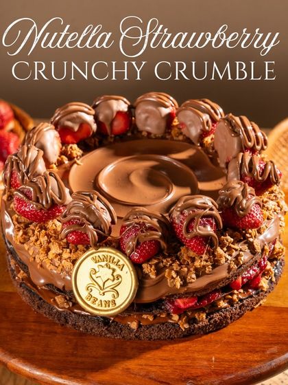Our Nutella Strawberry Crunchy Crumble cake, finished with our golden Vanilla Beans seal. The house-made crumble adds a nutty, addictive crunch to every slice.