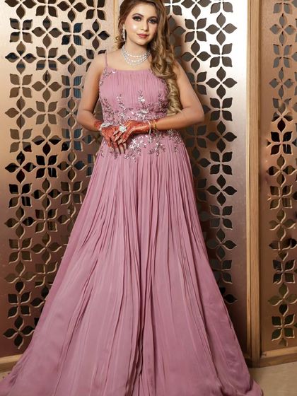 This pleated pink gown with silver floral embroidery is perfect for a reception or engagement party.