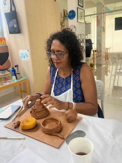 A participant carefully crafting miniature items from clay. My workshops guide you through creating both functional and decorative pieces.