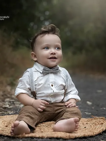 A dapper little boy enjoying the fresh air. We love the soft, natural light of outdoor settings for creating timeless baby portraits.
