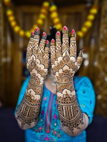 Dome designs are one of my favorites for bridal work. Here they are featured prominently on the back of the hands, creating a regal and architectural feel.