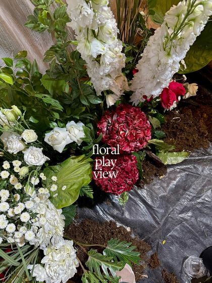 A "floral play view" of an arrangement in progress. This is the beautiful chaos of our workshop, where we bring together different elements to create something new.