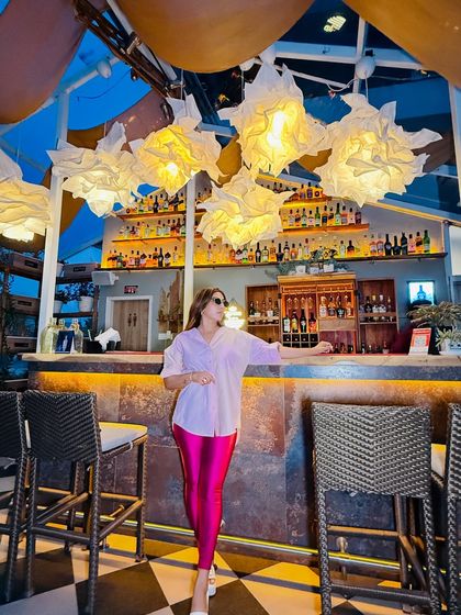 Comfort meets glam in this outfit. I've paired shiny statement leggings with a crisp oversized cotton shirt, balancing the look with chunky footwear for a power-styling move.