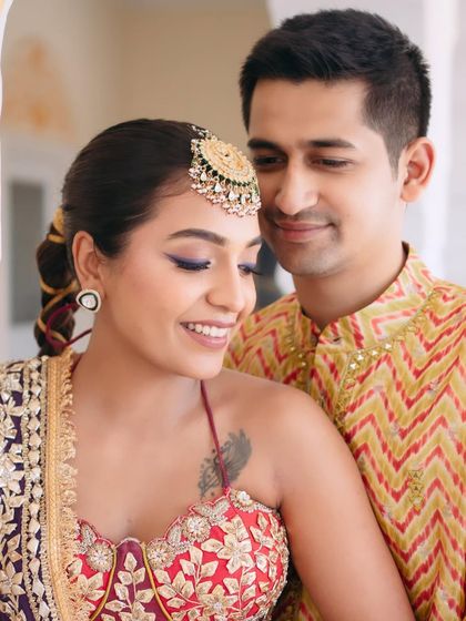 A close-up of Mishi's playful and modern Mehndi look. The purple winged eyeliner adds a fun pop of color, while her skin remains fresh and luminous.