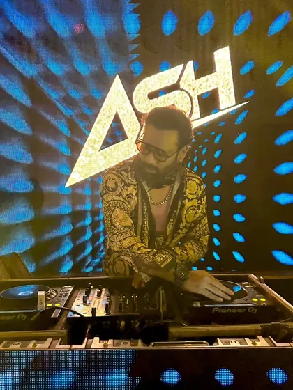 A great shot of me at the console with my logo and dynamic blue visuals lighting up the background. This setup is perfect for making a strong visual impact.