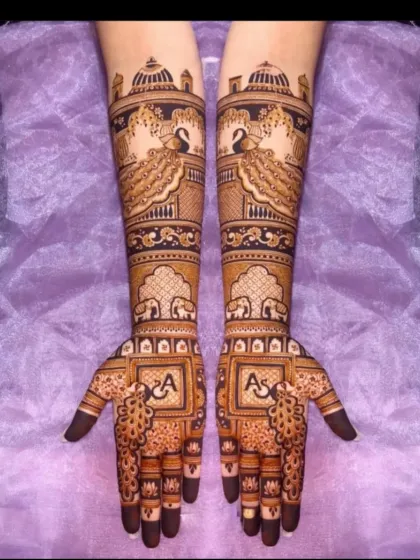 A royal design with peacocks perched on palace architecture and personalized initials on the palms.
