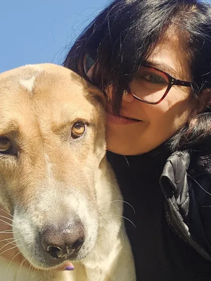 A selfie of a team member with one of our beloved resident dogs. The love is real.