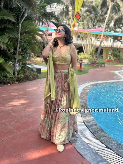 A happy client looking chic and relaxed in a printed lehenga by the pool. This shows how versatile and comfortable my rental outfits are for destination weddings.