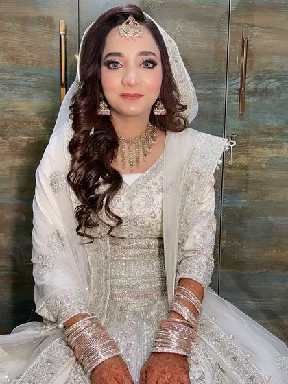 My gorgeous bride in her all-white Walima outfit. The soft makeup with defined eyes and a neutral lip creates a look of pure elegance.