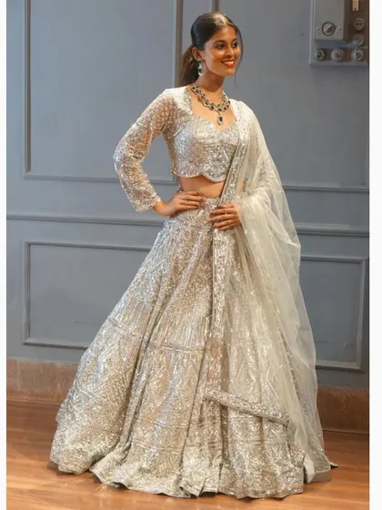Get ready to sparkle in this full-flair silver sequin lehenga. It’s one of our bestsellers for a reason. Perfect for a sangeet or cocktail night, this outfit is all about glamour and fun.