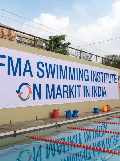 Our brand is synonymous with professional swimming. This banner overlooks a competition-ready pool, highlighting our connection to the world of professional aquatics and our ability to maintain pools to a competitive standard.
