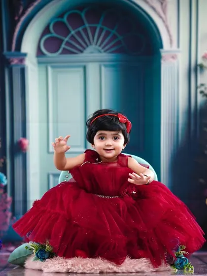Another happy wave from the birthday princess, capturing the joy of her special day.