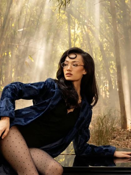 A portrait of the female model from the John Jacobs campaign, with soft, diffused light creating an ethereal mood.