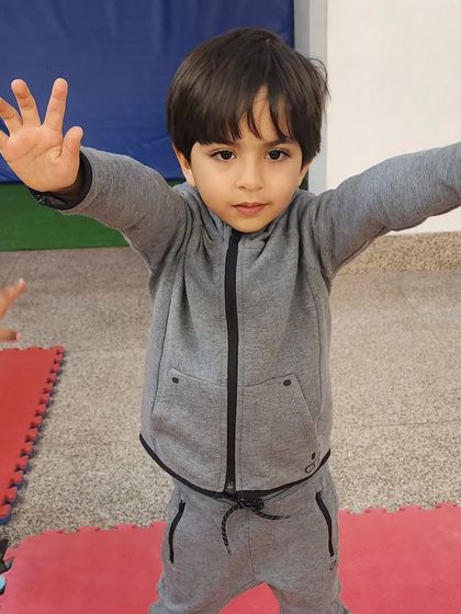 This little guy is striking a pose with confidence. Our classes help even the shyest kids to open up and express themselves.