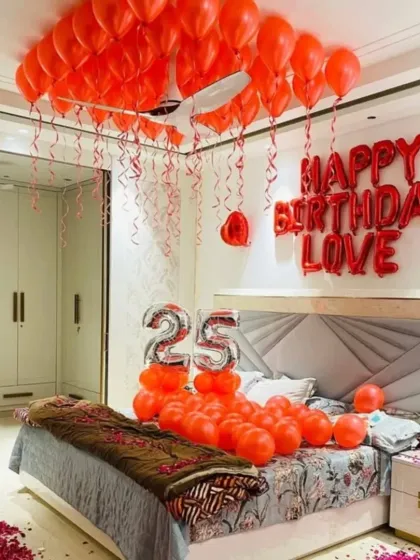 A full room view of the 25th birthday surprise, showing the decorated bed, rose petals on the floor, and balloons.