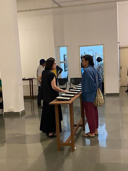 The gallery space filled with conversations and art.