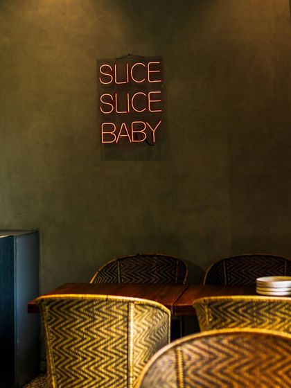 Experience pizza perfection at Camillo's. My modern decor and comfortable seating make it the perfect spot to enjoy a slice.