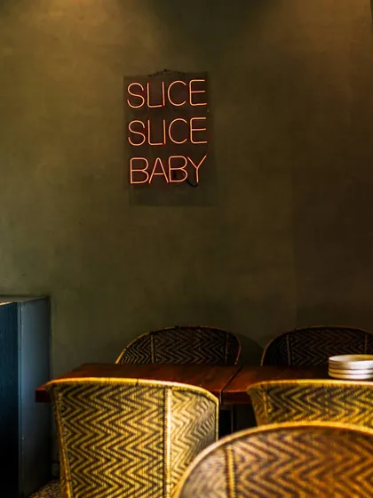Experience pizza perfection at Camillo's. My modern decor and comfortable seating make it the perfect spot to enjoy a slice.