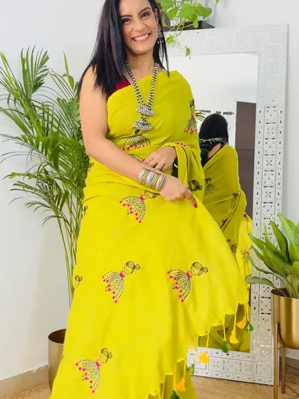 This bright yellow Khadi cotton saree with peacock embroidery is so fun and festive. It's a great choice for a casual daytime event or a small puja.