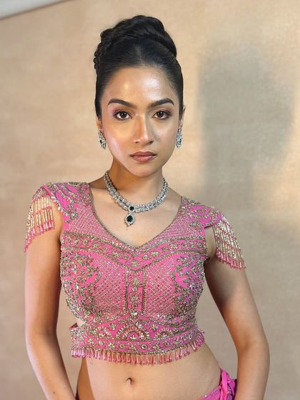 A high fashion, voluminous braided bun, perfect for a model or a bride who wants a dramatic and stylish look.