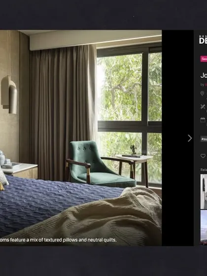 The serene bedrooms of the Jor Bagh Residence, featuring a mix of textured pillows and neutral quilts, as seen on Design Dekko.
