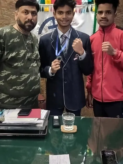 In my office with the winners. I believe in personally acknowledging the hard work and success of every single one of my boxers.