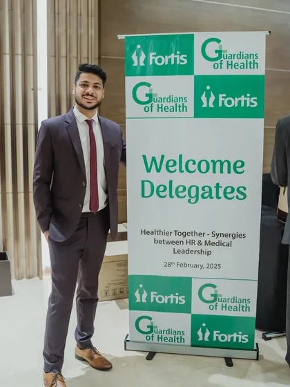 Posing next to the welcome banner for the Fortis Healthcare "Guardians of Health" event. It was an honor to perform for the doctors and medical leadership.