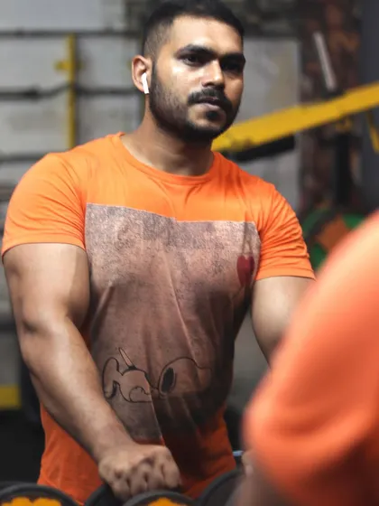 Looking in the mirror while grabbing dumbbells. This is where the plan for the next set is made.