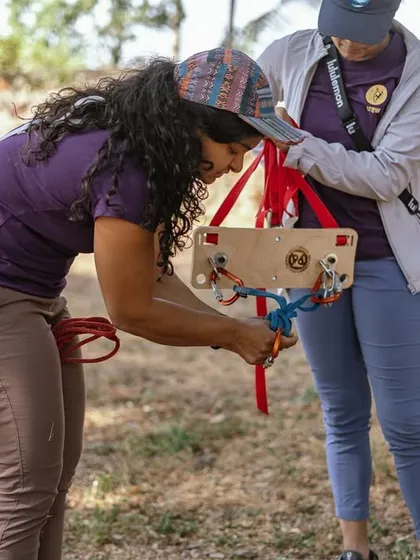 We use tools like this portable Skillzboard to teach rope techniques and knots in a hands-on way. It's a great way to practice tying in and setting up anchors before you even get on the rock.