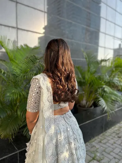 This angle captures the beautiful movement of the hair and the simplicity of the style.