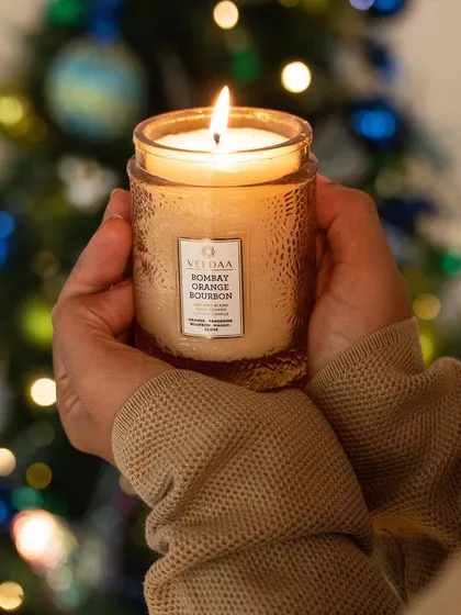 Hold the warmth of the holidays in your hands. Our Bombay Orange Bourbon candle offers a cozy, festive fragrance, perfect for uplifting your spirits on a cold winter day.