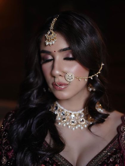 The details are everything. This shot highlights the soft smokey eyeshadow and the perfectly blended skin, creating a flawless canvas.