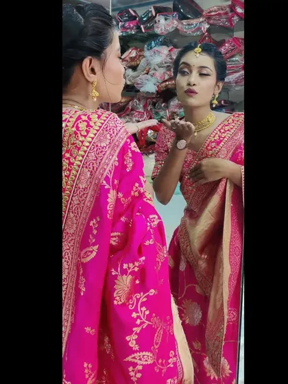 A candid moment showing how confident and beautiful my client felt. The makeup is designed to look stunning from every angle, complementing her traditional attire and gold jewelry perfectly.