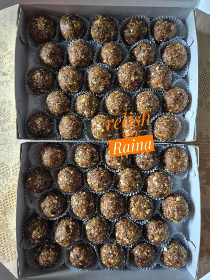 Two boxes of my coarsely ground Dry Fruit Laddoos. This preparation makes them a hit with kids and ensures they get their dose of healthy nuts.