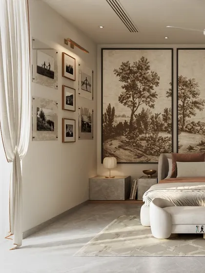 A gallery wall of personal photos adds a layer of individuality to this serene bedroom. The simple frames and black-and-white images complement the room's neutral tones, making the space feel both curated and deeply personal.