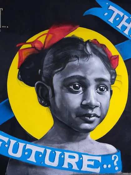 A powerful mural titled "The Future..?" created during our launch. This piece is a testament to the incredible talent and thought-provoking art that finds a home at the Circus.