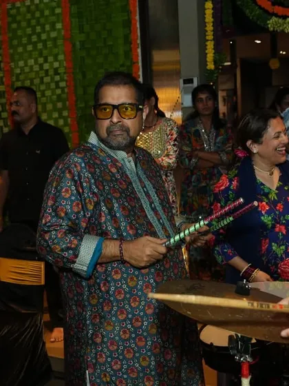 A guest enjoying the music and playing the dhol. I often collaborate with live musicians to add an extra layer of energy to my festival sets.