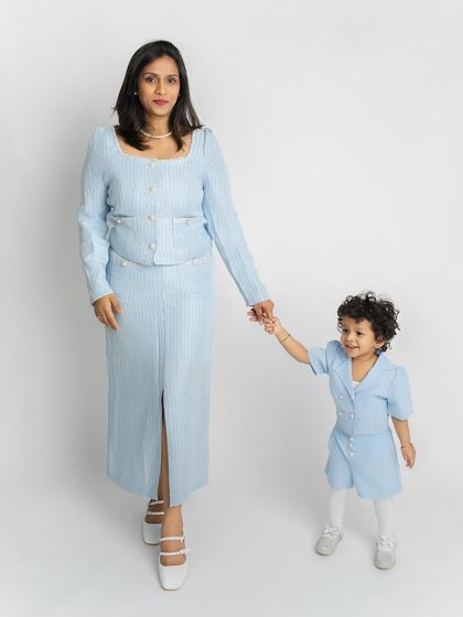 A mother and daughter portrait that feels both elegant and sweet. I guided them into a gentle walking pose to capture their connection and the beautiful matching outfits.