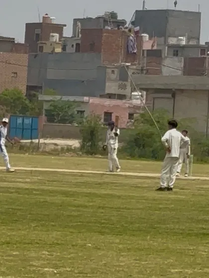 A player in action during the final match. Every run was crucial in this tight contest.